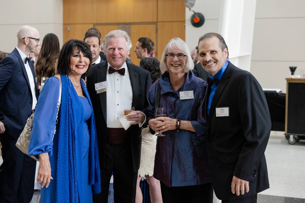 President Mantella smiling and posing with Jack and Susan Smith and Bob Avery